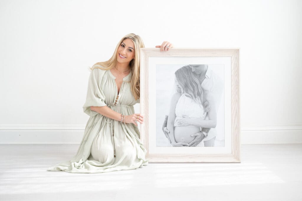 Sarah and a framed portrait | Tampa full service photographer