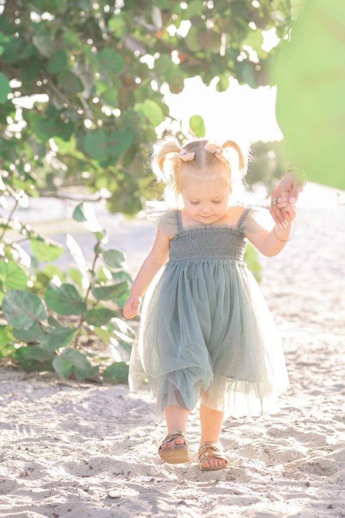 Baby sister walking on the beach | Sarah Williams Portraits