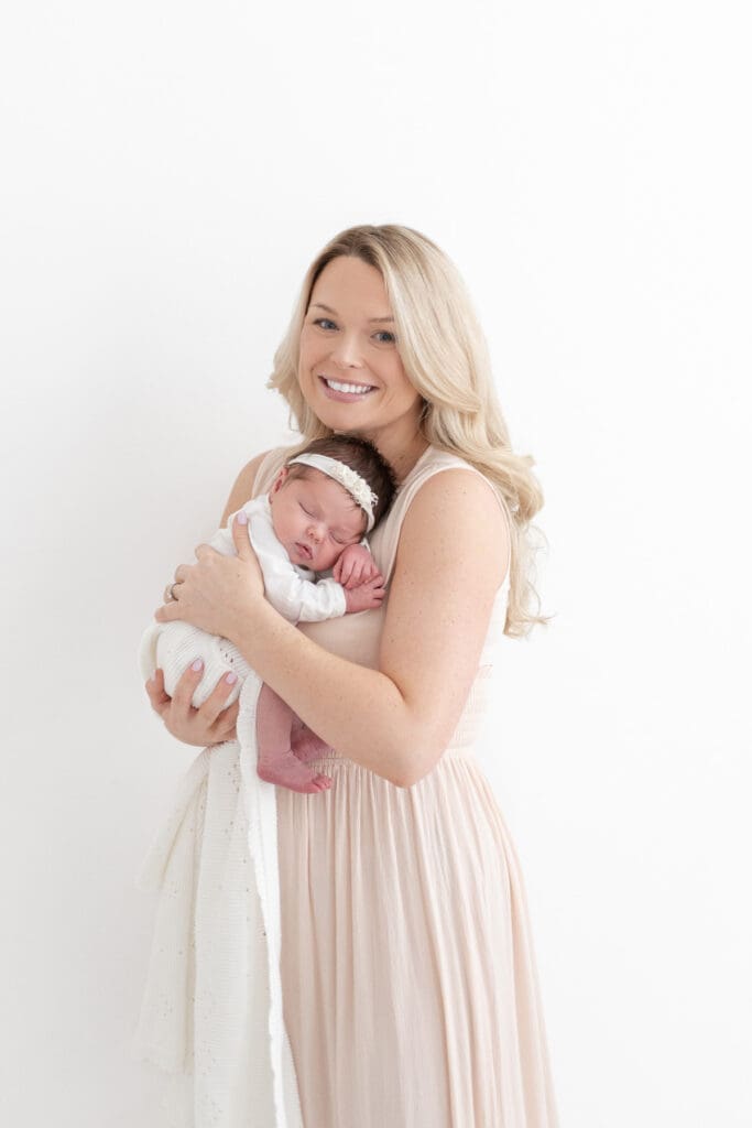 Mom holding newborn baby girl