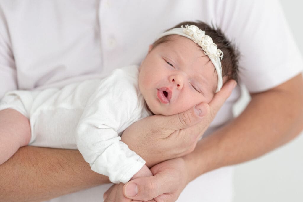 Dad holding newborn baby girl | Sarah Williams Portraits