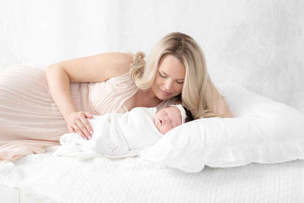 Mom with baby girl on the bed | Sarah Williams Portraits